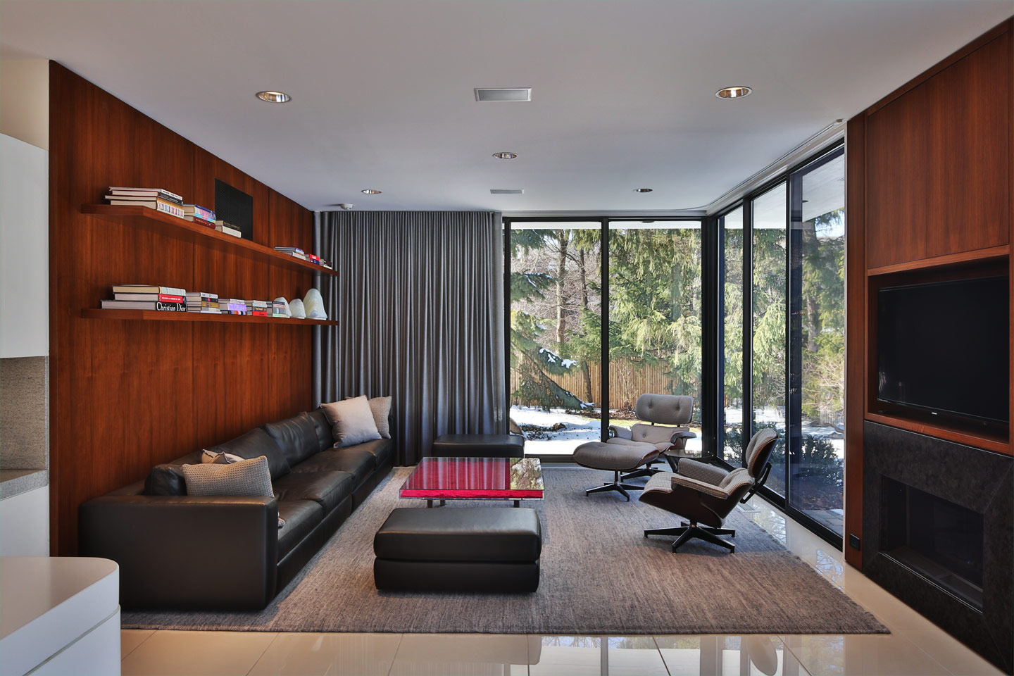 a beautiful ultra-modern living room surrounded by glass, built by berliant builders
