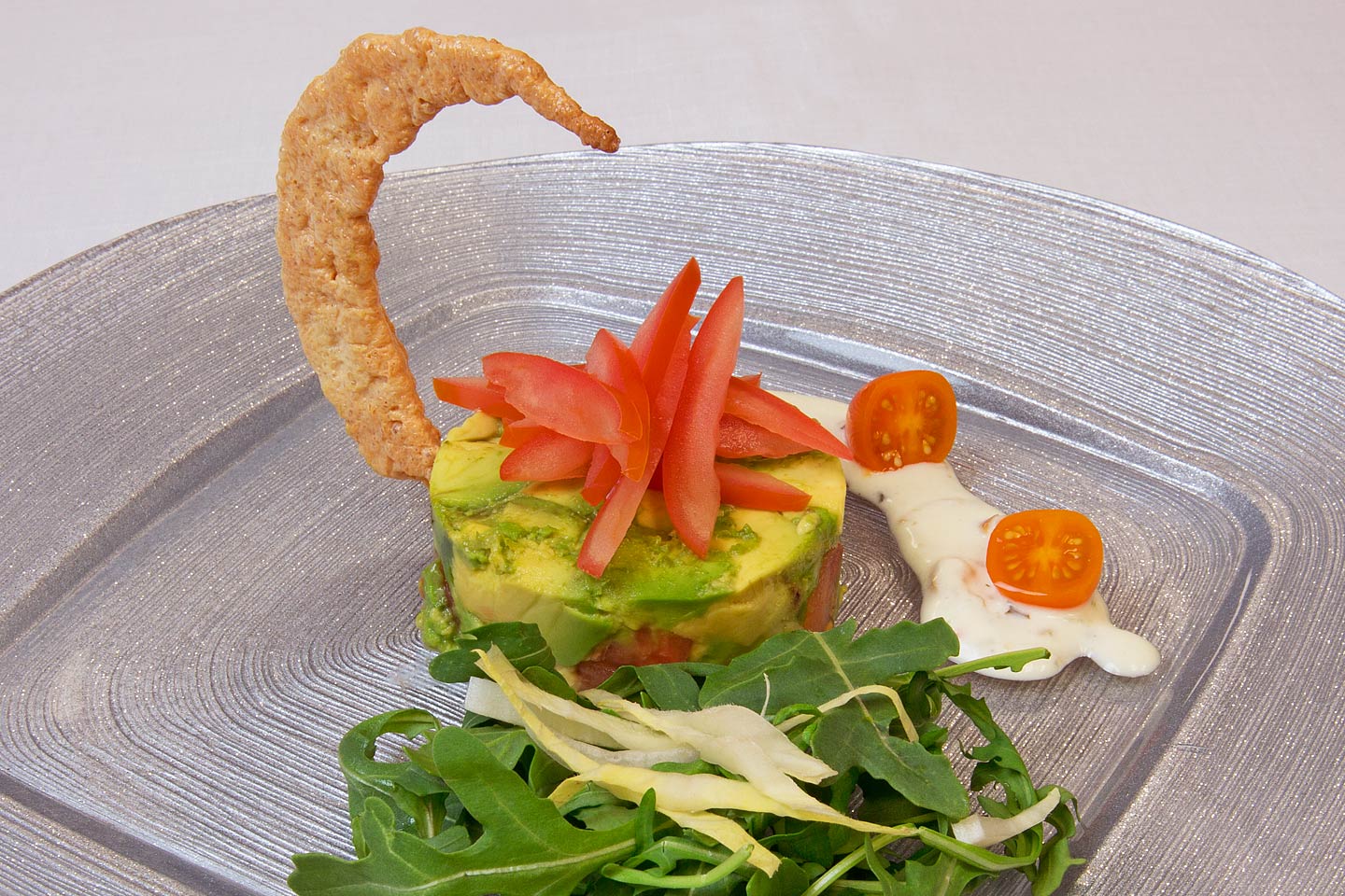 delicious gourmet kosher salad featuring a crispy crescent moon cracker prepared by danziger kosher catering and served on a circle square charger plate